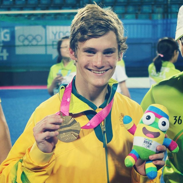 Alec Rasmussen holding his gold medal at the Nanjing 2014 Youth Olympic Games